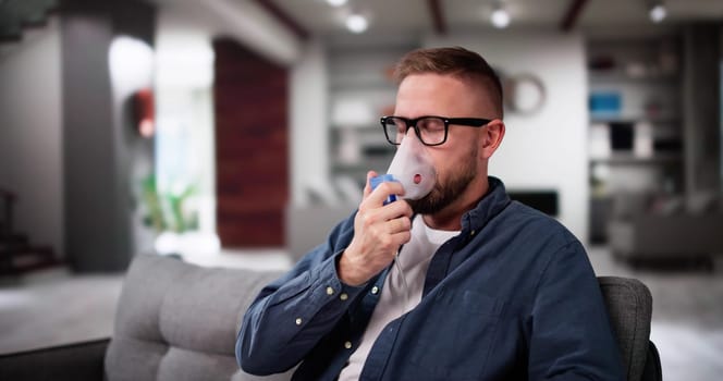 Asthma Patient Breathing Using Oxygen Mask And COPD Nebulizer