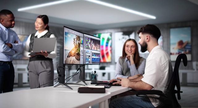 Graphic Designer Artist Team Working On Multiple Computer Screens