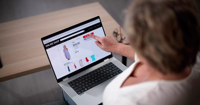 Woman Sitting On Couch Doing Online Shopping