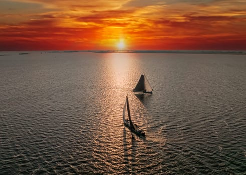 Aerial from traditional skutsjessilen on the Heegermeer in Friesland the Netherlands at sunset
