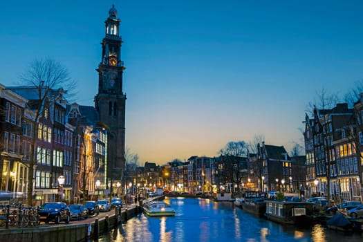 City scenic from Amsterdam with the Westerkerk in the Netherlands at sunset