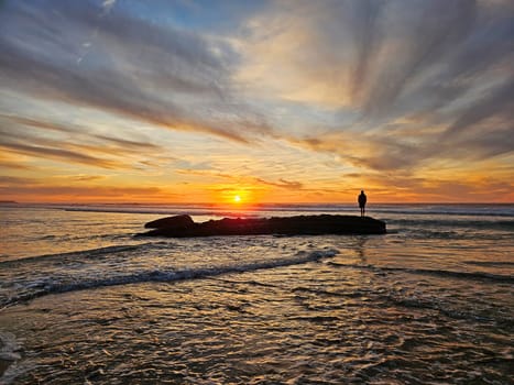 Beautiful sunset at Praia Vale Figueiras in Portugal