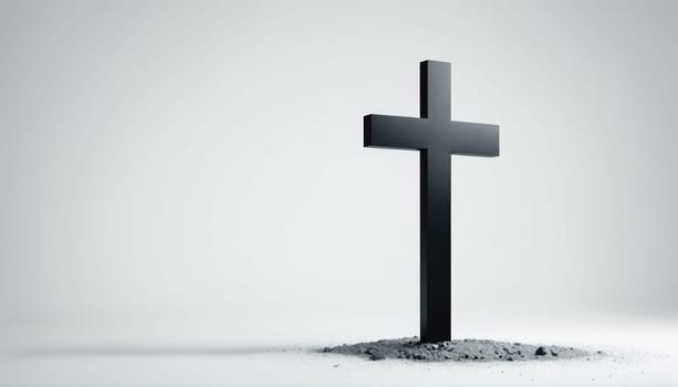 A stark black cross is planted in gray soil, set against a soft gray background. The scene evokes feelings of solitude and contemplation on spirituality and existence.