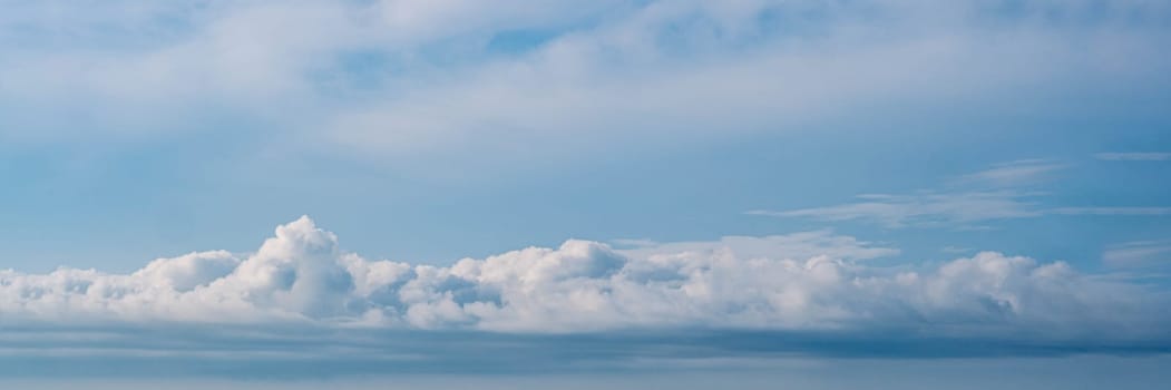 BANNER Atmosphere long panorama real photo beautiful summer white cloud clear blue sky line calm. Concept paradise life. Design relax wallpaper background More tone format fantasy collection in stock