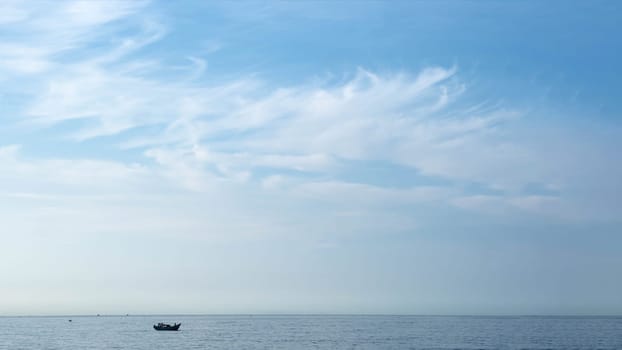 Atmosphere panorama white cloud clear blue sky horizon line calm empty sea lone fishing boat. Concept paradise life. Design relax wallpaper background. More tone format collection in stock.