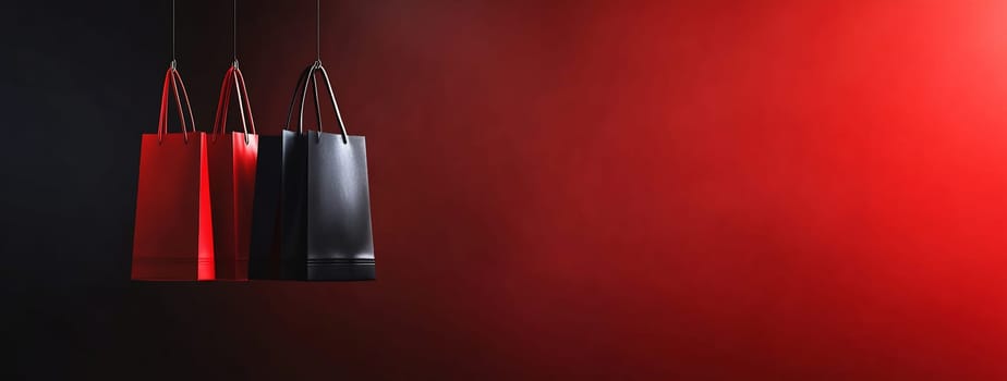 Three shopping bags hang against a dark backdrop, featuring vibrant colors of red and black. The lighting enhances their striking appearance.
