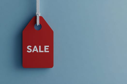 A bright red tag marked with the word sale hangs against a soft blue background, emphasizing current discounts and promotions.