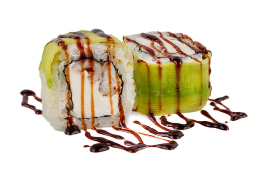 Sushi roll on a white background with Philadelphia cheese, avocado and tuna, sprinkled with soy sauce.