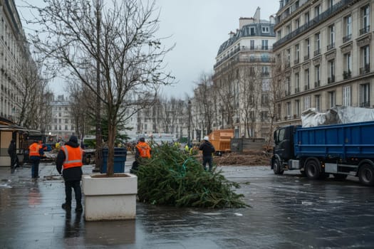 Workers in Paris remove the Christmas tree and decorations after the Christmas holidays