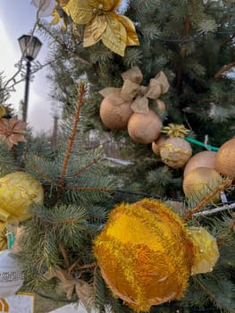 The Christmas tree is decorated with elegant decorative Christmas tree toys
