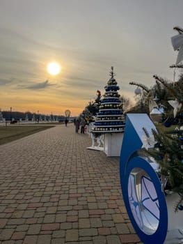 embankment by the Sozh river in Gomel at sunset in winter