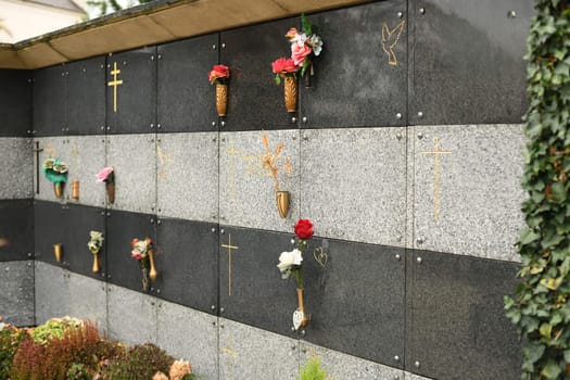 Family columbarium for burial of urns with ashes or coffins European cemetery with graves