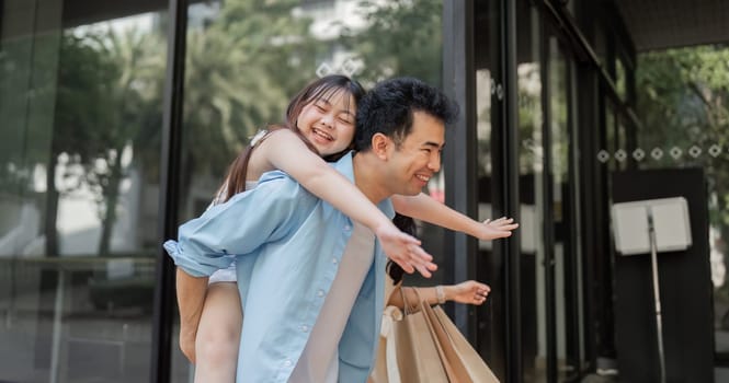 A cheerful family embarks on a holiday shopping trip, capturing the joy and excitement of parents and children during the festive season.