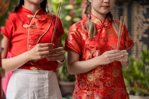 Witness the vibrancy of Chinese New Year through traditional attire and festive celebrations filled with joy and cultural pride.