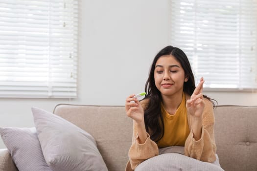 A woman anxiously awaits her pregnancy test results contemplating her future and the potential of new life in her womb.