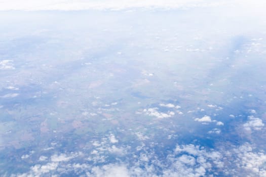 View from airplane window to earth's surface. High quality photo