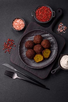 Fried chickpea falafel balls with salt, spices and herbs. Vegetarian and vegan dish