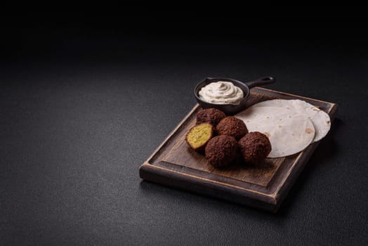 Fried chickpea falafel balls with salt, spices and herbs. Vegetarian and vegan dish