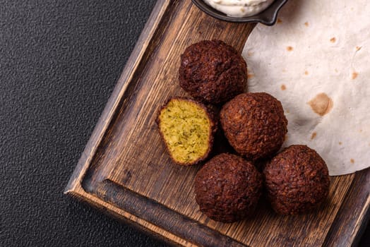 Fried chickpea falafel balls with salt, spices and herbs. Vegetarian and vegan dish