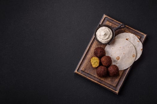 Fried chickpea falafel balls with salt, spices and herbs. Vegetarian and vegan dish