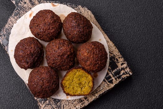 Fried chickpea falafel balls with salt, spices and herbs. Vegetarian and vegan dish