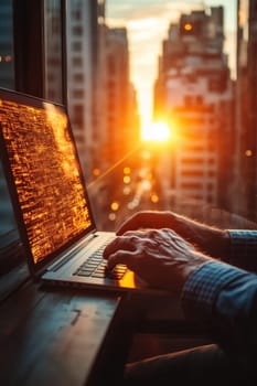 Close-up of a man's hand typing on a keyboard in the background of the sunset outside the window. Writing a letter on a laptop keyboard.