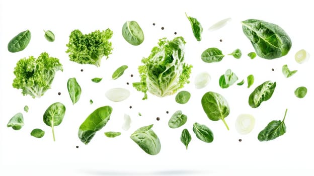 Green Lettuce Leaves and onions fly in the air on a white isolated background.