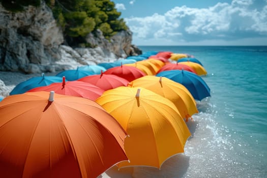 Lots of colored umbrellas to create shade on a hot day at the beach. Colorful umbrellas are spread out on the tropical beach.