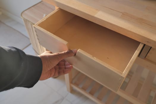 top view of men hand open a a drawer ,