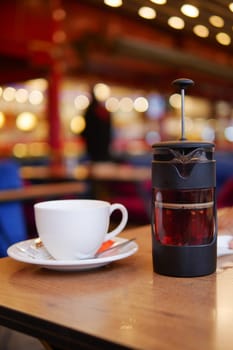 Enjoy herbal tea brewed in a French press, with fresh lemon slices for extra flavor
