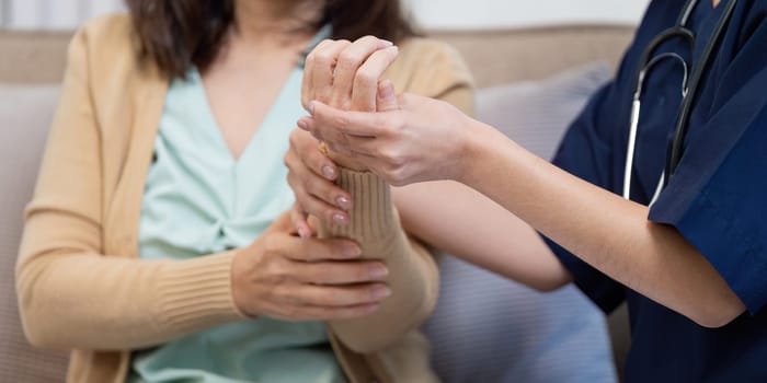 A caregiver and healthcare professionals assess an elderly patient symptoms with care.