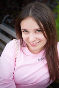 Portrait of young nice pretty woman with long brown hair