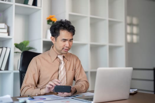 A business professional uses technology to enhance productivity in a contemporary office setting.