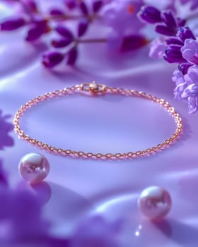 Close-up of a gold chain bracelet surrounded by purple flowers on a soft lilac background, embodying elegance and sophistication. Space for text