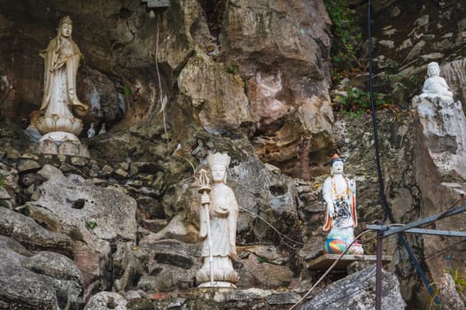 Buddha sculptures in the garden at the pagoda in the marble mountains of Da Nang