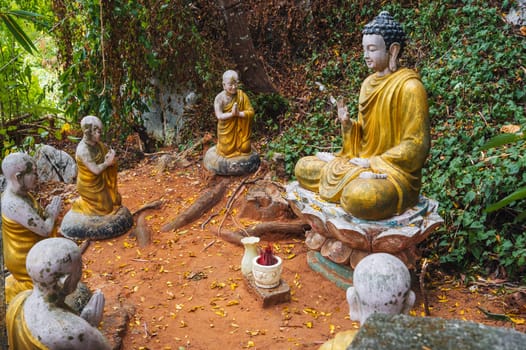 Buddha sculptures in the garden at the pagoda in the marble mountains of Da Nang