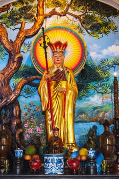 An altar with a Buddhist god inside a pagoda on the marble mountains of Da Nang