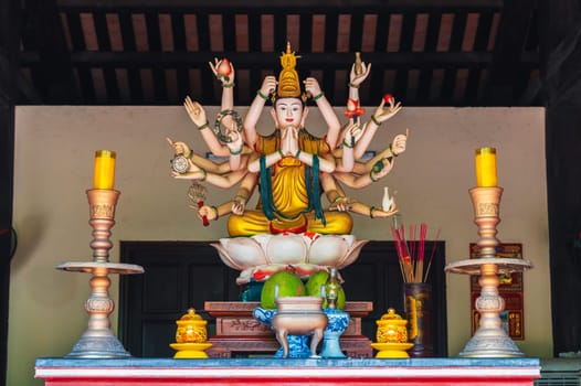 An altar with Shiva inside a temple on the Marble Mountains in Da Nang, Vietnam.