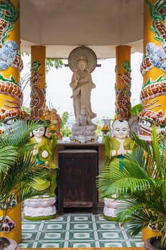 A statue with a Buddha inside a temple on the Marble Mountains in Da Nang, Vietnam.
