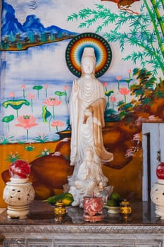 An altar with a Buddha inside a temple on the Marble Mountains in Da Nang, Vietnam.