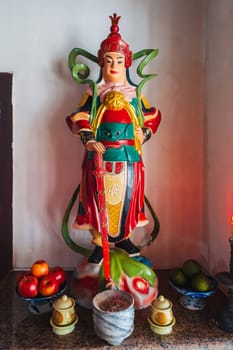 A statue with a Buddhist god inside a temple on the Marble Mountains in Da Nang, Vietnam.