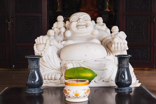 The white Buddha inside the Temple on the Marble Mountains in Da Nang, Vietnam.