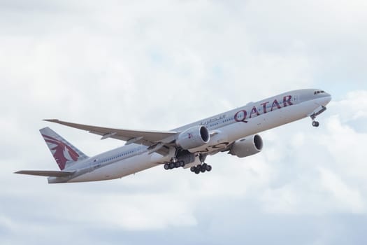 MELBOURNE, AUSTRALIA - SEPTEMBER 07, 2024: A Qatar Airways Boeing 777-3DZ(ER) takes off from Melbourne on September 7th 2024