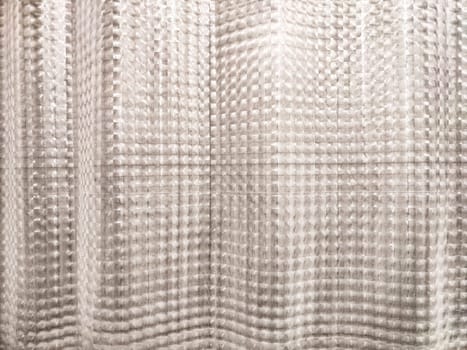 This unique textured background features a soft pattern that provides an appealing space for adding textual elements in designs.
