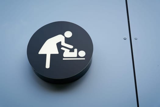 Sign for a baby changing room on the beach of the German Baltic Sea