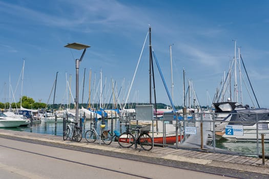 Sailing boats in the marina on the Hafenstrasse in Constance on Lake Constance in Germany on a warm summer's day