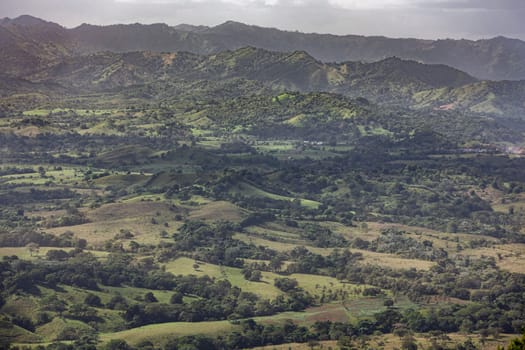 Scenic landscape showcasing the verdant hills and valleys of montana redonda in the dominican republic