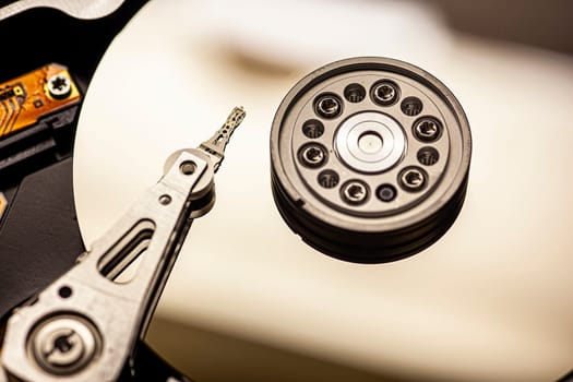 Macro view of a hard disk drive, showcasing its internal components and data storage mechanism