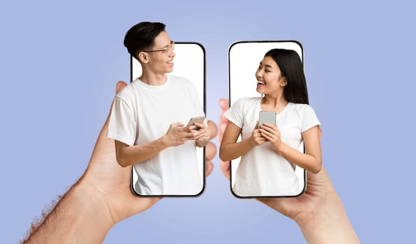 A young couple interacts joyfully while using smartphones. They share smiles and laughter, highlighting their connection through technology.