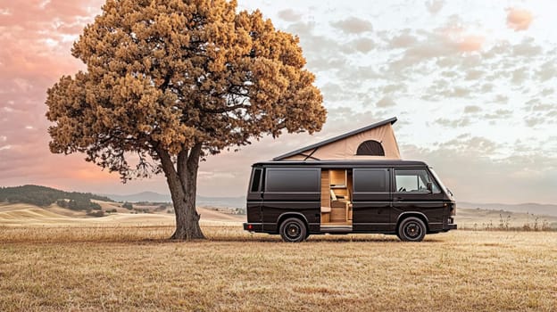 Modern camper van parked in the countryside, offering a luxurious and comfortable way to explore nature. The van features a sleek black exterior, wooden accents, and a spacious interior